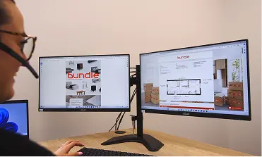 A Bundle team member assembling a bed